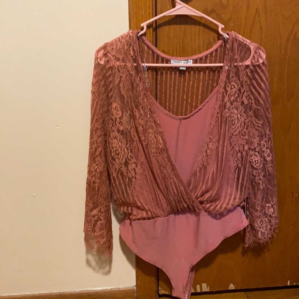 More like a burgundy/ maroon color bodysuit